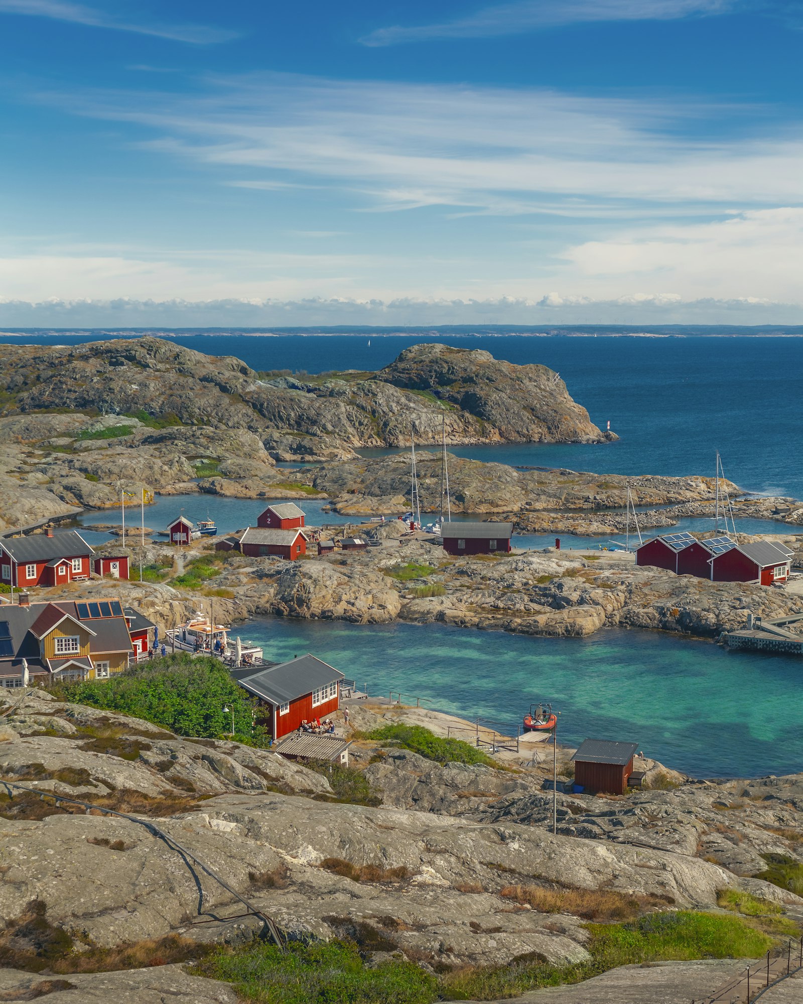 Houses by calm water on the Väderöarna islands on the Swedish west coast