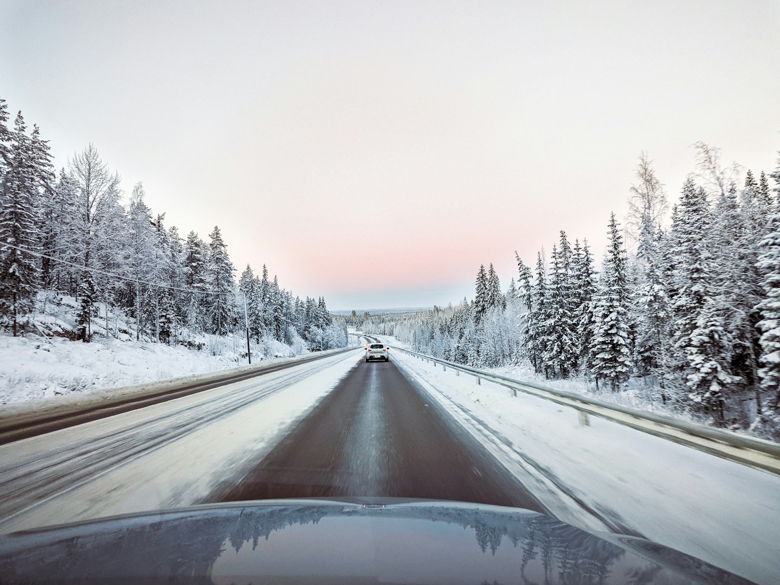 A car on a snow-covered road near Umeå in northern Sweden